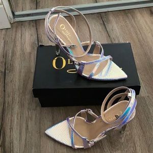 Silver hologram snake skin heels.